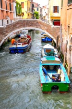 Canal, bridge and boat, Venice, Italy